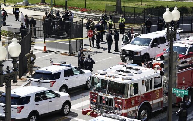 Police and fire officials stand near a car that crashed into a barrier on Capitol Hill in Washington, Friday, April 2, 2021. (AP Photo/J. Scott Applewhite) Police and fire officials stand near a car that crashed into a barrier on Capitol Hill in Washington, Friday, April 2, 2021. (AP Photo/J. Scott Applewhite)