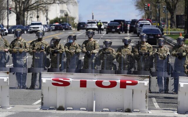Troops stand guard near the scene of a car that crashed into a barrier on Capitol Hill in Washington, Friday, April 2, 2021. (AP Photo/Patrick Semansky) Troops stand guard near the scene of a car that crashed into a barrier on Capitol Hill in Washington, Friday, April 2, 2021. (AP Photo/Patrick Semansky)