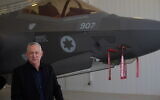 Defense Minister Benny Gantz stands in front of an F-35 fighter jet at the Nevatim air base on April 12, 2021. (Judah Ari Gross/Times of Israel)