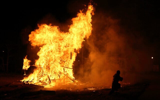 Illustrative: An ultra-Orthodox Jewish boy runs near a giant bonfire, during celebrations of the Jewish holiday of Lag B'Omer in Jerusalem's Mea Shearim neighborhood, April 28, 2013. (Yaakov Naumi/ Flash90) Illustrative: An ultra-Orthodox Jewish boy runs near a giant bonfire, during celebrations of the Jewish holiday of Lag B'Omer in Jerusalem's Mea Shearim neighborhood, April 28, 2013. (Yaakov Naumi/ Flash90)