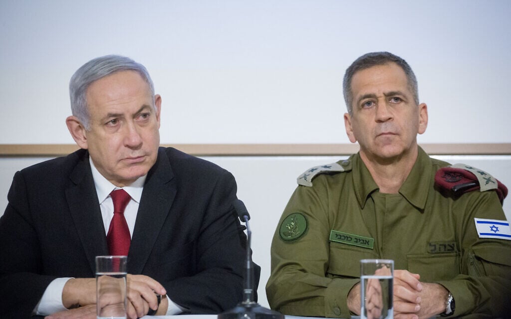 FILE: Prime Minister Benjamin Netanyahu and IDF Chief of Staff Aviv Kohavi at a press conference after a security cabinet meeting following the escalation of violence in the Gaza Strip, at IDF headquarters in Tel Aviv, on November 12, 2019. (Miriam Alster/Flash90)