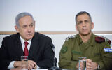 FILE: Prime Minister Benjamin Netanyahu and IDF Chief of Staff Aviv Kohavi at a press conference after a security cabinet meeting following the escalation of violence in the Gaza Strip, at IDF headquarters in Tel Aviv, on November 12, 2019. (Miriam Alster/Flash90)