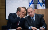 Prime Minister Benjamin Netanyahu, right, speaks with then Defense Minister Yamina party leader Naftali Bennett, March 4, 2020. (Yonatan Sindel/Flash90)
