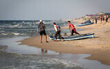 Palestinian fishermen prepare their nets for fishing in the Mediterranean Sea off Rafah in the southern Gaza Strip on September 2, 2020 (Abed Rahim Khatib/Flash90)