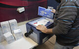 Pfizer-BioNTech's COVID-19 vaccines arrive at a Clalit vaccination center in Jerusalem, on January 4, 2021. (Olivier Fitoussi/ Flash90)