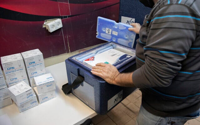 Pfizer-BioNTech's COVID-19 vaccines arrive at a Clalit vaccination center in Jerusalem, on January 4, 2021. (Olivier Fitoussi/ Flash90) Pfizer-BioNTech's COVID-19 vaccines arrive at a Clalit vaccination center in Jerusalem, on January 4, 2021. (Olivier Fitoussi/ Flash90)