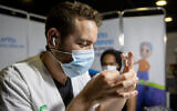 A COVID-19 vaccination center in Jerusalem, on March 11, 2021. (Yonatan Sindel/Flash90)