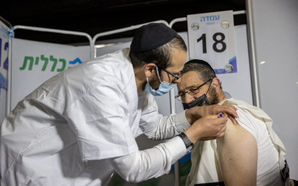 Illustrative image: a Haredi man receives a coronavirus vaccine in Jerusalem, on March 11, 2021. (Yonatan Sindel/Flash90) Illustrative image: a Haredi man receives a coronavirus vaccine in Jerusalem, on March 11, 2021. (Yonatan Sindel/Flash90)