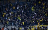 Soccer fans at a game between Beitar Jerusalem FC and Ashdod FC, at Teddy Stadium, in Jerusalem, on March 17, 2021. (Flash90)
