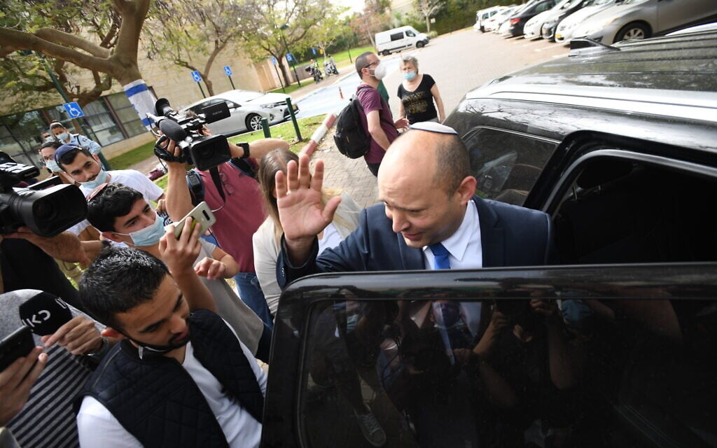 Yamina party leader Naftali Bennett arrives at a polling station to cast his vote during the elections, in Ra'anana on March 23, 2021. (Gili Yaari/Flash90) Yamina party leader Naftali Bennett arrives at a polling station to cast his vote during the elections, in Ra'anana on March 23, 2021. (Gili Yaari/Flash90)