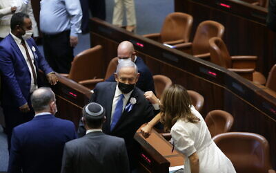 Prime Minister Benjamin Netanyahu with fellow MKs during the swearing-in ceremony of the 24th Knesset, April 6, 2021. (Alex Kolomoisky/POOL)