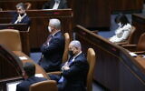 Defense Minister Benny Gantz (C-L) and Prime Minister Benjamin (C) in the Knesset, in Jerusalem, April 6, 2021. (Alex Kolomoisky/POOL/Flash90)