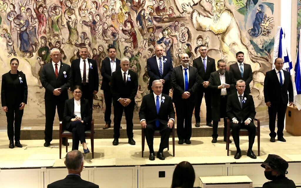 Party leaders pose for a group picture after the swearing-in ceremony of the 24th Knesset, April 6, 2021. Seated from left are Supreme Court president Esther Hayut, Prime Minister Benjamin Netanyahu and Knesset Speaker Yariv Levin (Marc Israel Sellem/POOL) Party leaders pose for a group picture after the swearing-in ceremony of the 24th Knesset, April 6, 2021. Seated from left are Supreme Court president Esther Hayut, Prime Minister Benjamin Netanyahu and Knesset Speaker Yariv Levin (Marc Israel Sellem/POOL)