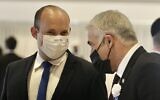 Yamina party leader Naftali Bennett (left) and Yesh Atid leader Yair Lapid during the swearing-in ceremony of the 24th Knesset, at the Knesset building in Jerusalem, April 6, 2021. (Marc Israel Sellem/Pool)