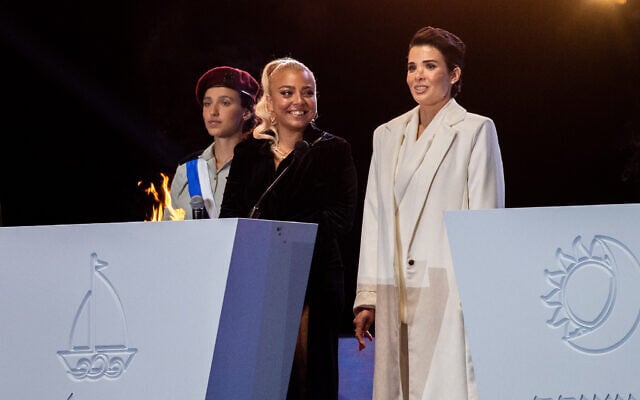 Shira Isakov (R) and Adi Guzi (L) light a torch during the 73rd anniversary Independence Day ceremony, held at Mount Herzl, Jerusalem on April 14, 2021. (Yonatan Sindel/Flash90) Shira Isakov (R) and Adi Guzi (L) light a torch during the 73rd anniversary Independence Day ceremony, held at Mount Herzl, Jerusalem on April 14, 2021. (Yonatan Sindel/Flash90)