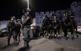 Police officers stand guard during clashes between Palestinians and Israeli police outside Damascus Gate in Jerusalem on April 18, 2021.  (Yonatan Sindel/Flash90)