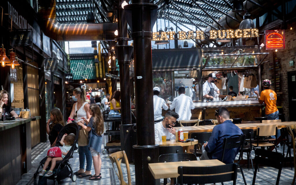 Customers enjoy dining at restaurants at the Sarona market in Tel Aviv on April 21, 2021. (Miriam Alster/Flash90) Customers enjoy dining at restaurants at the Sarona market in Tel Aviv on April 21, 2021. (Miriam Alster/Flash90)
