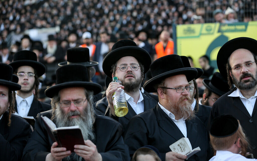 Jewish pilgrims at the gravesite of Rashbi, or Rabbi Shimon Bar Yohai, in Meron in the northern Galilee ahead of the start of the Jewish holiday of Lag B'Omer, on April 29, 2021. (David Cohen/Flash90)