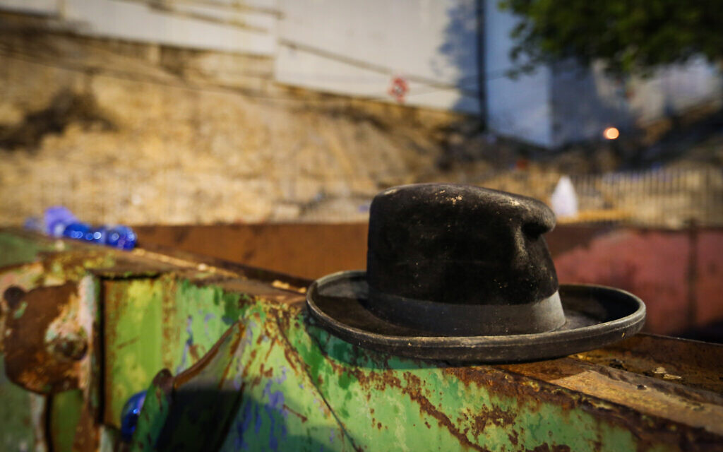 A hat at the scene of a deadly crush during the Jewish holiday of Lag B'Omer on Mt. Meron, in northern Israel on April 30, 2021 (David Cohen/Flash90)