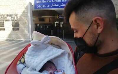 Yazidi newborn Hena arrives in Israel from Iraqi Kurdistan with her uncle to undergo life-saving heart surgery at Sheba Hospital (courtesy Shevet Achim)