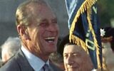 Britain’s Prince Philip jokes with British WWII veterans who immigrated to Israel, during a ceremony at the Commonwealth War Cemetery in Ramle, Israel, on October 30, 1994, where he came to lay a wreath. (AP Photo)