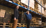 Pieter van Oordt, left, with his brother Roger at the Israel Products Center in Nijkerk, the Netherlands, February 19, 2016. (Cnaan Liphshiz via JTA)