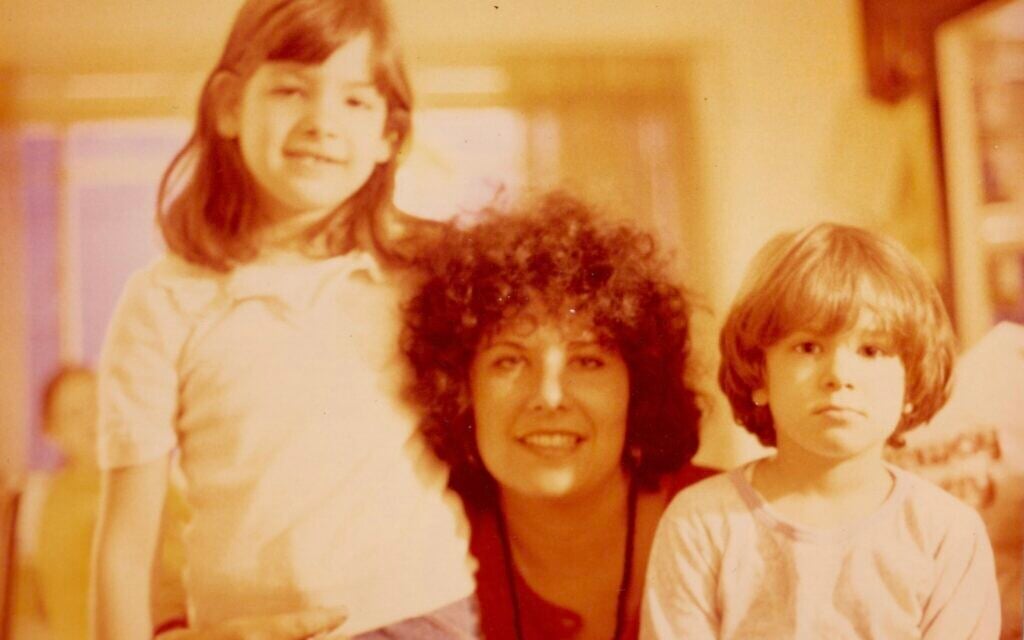 Ronit Plank (left) and her sister Nava reunited with their mother upon her return to the US from Bhagwan Shree Rajneesh's ashram in Poona, India, 1980. (Courtesy)