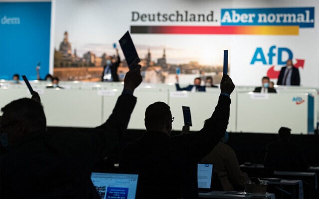 Delegates vote on an amendment on the second day of the congress of far-right Alternative for Germany (AfD - Alternative fuer Deutschland) party in Dresden, eastern Germany, on April 11, 2021. (Jens Schlueter/ AFP) Delegates vote on an amendment on the second day of the congress of far-right Alternative for Germany (AfD - Alternative fuer Deutschland) party in Dresden, eastern Germany, on April 11, 2021. (Jens Schlueter/ AFP)
