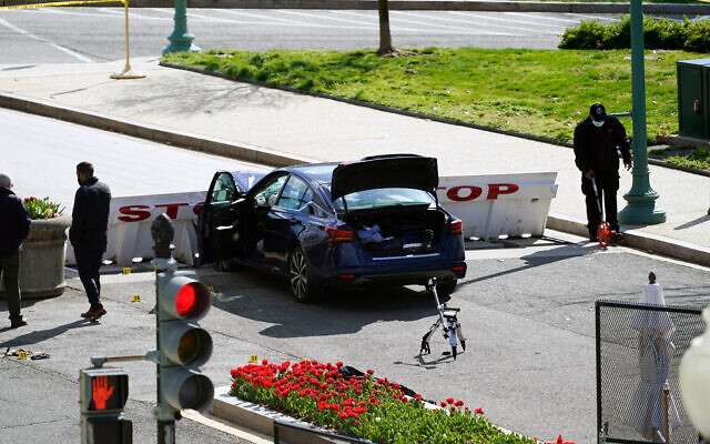 Authorities investigate at the scene where a car crashed into a barrier on Capitol Hill in Washington, April 2, 2021. (AP Photo/Alex Brandon) Authorities investigate at the scene where a car crashed into a barrier on Capitol Hill in Washington, April 2, 2021. (AP Photo/Alex Brandon)