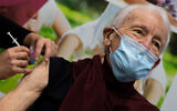 A man receives a COVID-19 vaccine in Apeldoorn, Netherlands, Jan. 26, 2021. (AP Photo/Peter Dejong)