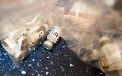 Empty vials of the Johnson & Johnson's one-dose COVID-19 vaccine are seen at the Vaxmobile, at the Uniondale Hempstead Senior Center in Uniondale, New York, March 31, 2021. (AP Photo/Mary Altaffer)