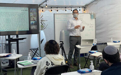 Shalhevet High School in Los Angeles invested in remote learning technology during the pandemic. In the fall, students located in Arizona will begin to attend Shalhevet classes via video. (Courtesy/Tushar Dwivedi via JTA)