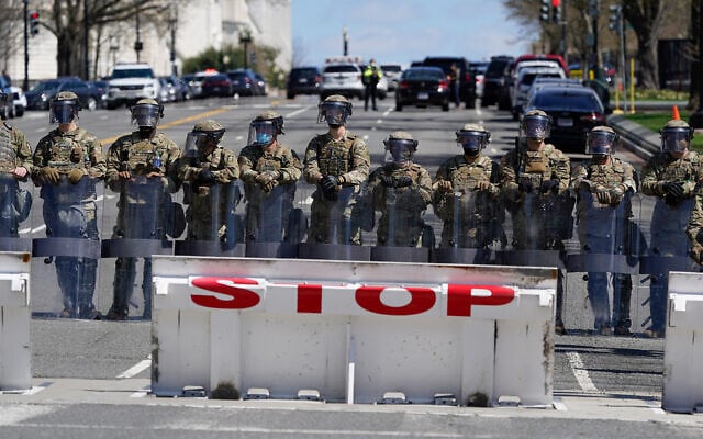 Troops stand guard near the scene of a car that crashed into a barrier on Capitol Hill in Washington, April 2, 2021. (AP Photo/Patrick Semansky) Troops stand guard near the scene of a car that crashed into a barrier on Capitol Hill in Washington, April 2, 2021. (AP Photo/Patrick Semansky)