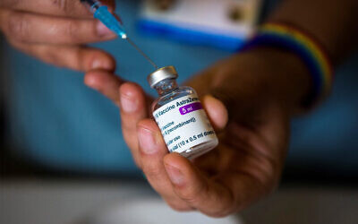 A doctor prepares to administer the Oxford/AstraZeneca COVID-19 vaccine in London, January 7, 2021. (Kirsty O'Connor/POOL/AFP)
