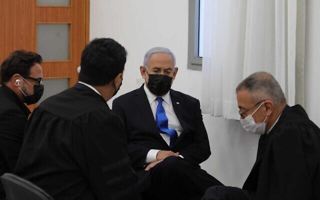 Prime Minister Benjamin Netanyahu sits with his lawyers ahead of the hearing in the Jerusalem District Court, March 5, 2021. (Oren Ben Hakoon/Pool) Prime Minister Benjamin Netanyahu sits with his lawyers ahead of the hearing in the Jerusalem District Court, March 5, 2021. (Oren Ben Hakoon/Pool)