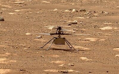 In this image from NASA, NASA's experimental Mars helicopter Ingenuity stands on the surface of Mars (NASA via AP) In this image from NASA, NASA's experimental Mars helicopter Ingenuity stands on the surface of Mars (NASA via AP)