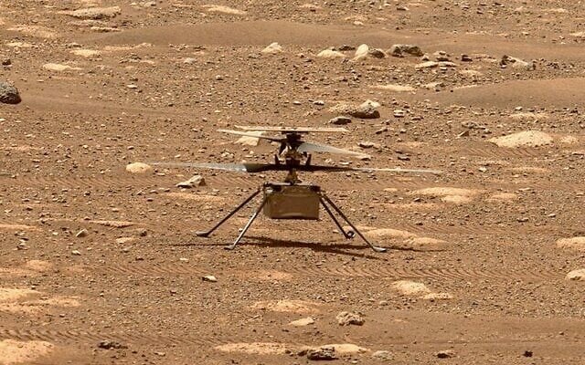 In this image from NASA, NASA's experimental Mars helicopter Ingenuity stands on the surface of Mars (NASA via AP) In this image from NASA, NASA's experimental Mars helicopter Ingenuity stands on the surface of Mars (NASA via AP)