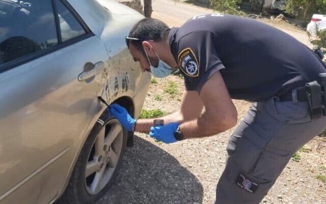 Police forces operate in the northern town of Kamanneh following a suspected hate crime, on April 9, 2021. (Israel Police Spokesperson) Police forces operate in the northern town of Kamanneh following a suspected hate crime, on April 9, 2021. (Israel Police Spokesperson)