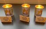 Debra Barnes's friend Karen posted a photo of the yellow candles online -- without knowing one of them (left) was in memory of Debra's aunt. (Courtesy Jewish News)