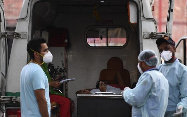 A COVID-19 patient lies in an ambulance while waiting to get an admission in a hospital in New Delhi on May 1, 2021. (Tauseef Mustafa/AFP) A COVID-19 patient lies in an ambulance while waiting to get an admission in a hospital in New Delhi on May 1, 2021. (Tauseef Mustafa/AFP)