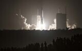 In this file photo a Long March 5B rocket carrying China's Chang'e-5 lunar probe launches from the Wenchang Space Center on China's southern Hainan Island on November 24, 2020, on a mission to bring back lunar rocks, the first attempt by any nation to retrieve samples from the moon in four decades (STR / AFP)