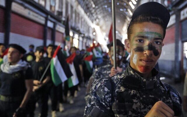 Syrian and Palestinian children take part in a rally to mark al-Quds Day, on May 7, 2021, at the covered bazaar of Hamidiya in Syria's capital Damascus (Louai Beshara / AFP) Syrian and Palestinian children take part in a rally to mark al-Quds Day, on May 7, 2021, at the covered bazaar of Hamidiya in Syria's capital Damascus (Louai Beshara / AFP)