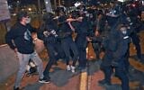 Israeli policemen clash with demonstrators protesting a possible eviction of local Palestinian families in the Sheikh Jarrah neighborhood of East Jerusalem, on May 8, 2021. (Menahem KAHANA / AFP)