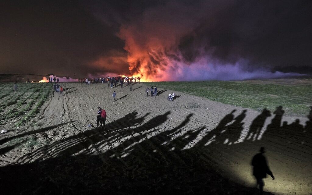 Palestinians riot at the Israel-Gaza border, in al-Bureij in the central Gaza Strip, on May 8, 2021. (MOHAMMED ABED / AFP) Palestinians riot at the Israel-Gaza border, in al-Bureij in the central Gaza Strip, on May 8, 2021. (MOHAMMED ABED / AFP)