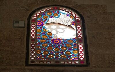 A window of Al-Aqsa Mosque is seen shattered following renewed clashes between Palestinians and Israeli police in Jerusalem's Old City on May 10, 2021 (Ahmad Gharabli / AFP) A window of Al-Aqsa Mosque is seen shattered following renewed clashes between Palestinians and Israeli police in Jerusalem's Old City on May 10, 2021 (Ahmad Gharabli / AFP)
