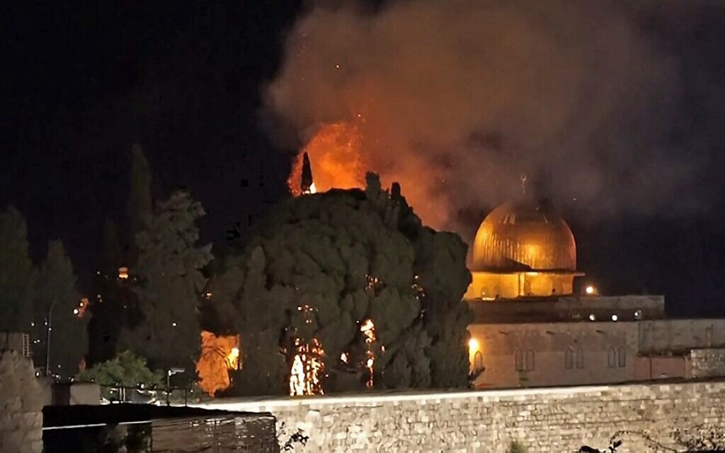 A grab from an AFPTV video shows a tree on fire near the Dome of the Rock on May 10, 2021. (Claire Gounon/AFPTV/AFP)