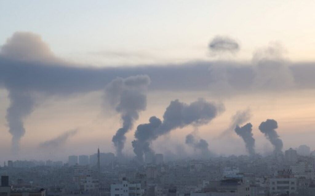 Smoke rises after a series of Israeli air strikes in Gaza City , early on May 12, 2021. (Photo by MOHAMMED ABED / AFP)