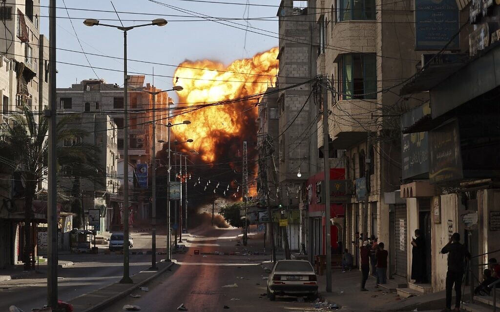 Black smoke billows after an Israeli airstrike on Gaza City targeted the Intaj Bank linked to Hamas on May 14, 2021. (MOHAMMED ABED / AFP)