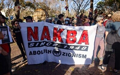 Palestinian and Israeli residents of the coastal city of Jaffa near Tel Aviv, hold a banner as they take part in a rally on May 15, 2021, as Palestinians mark the 73rd anniversary of the Nakba, the "catastrophe" of Israel's creation in 1948 (Ahmad GHARABLI / AFP)