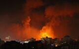 Smoke billows from a fire following Israeli airstrikes on multiple targets in Gaza City, early on May 16, 2021 (MOHAMMED ABED / AFP)